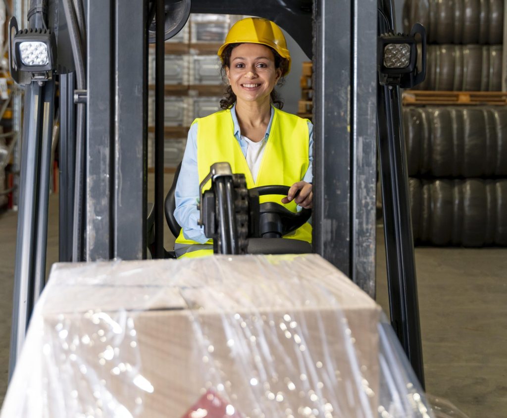 Proiecte 6 woman driving warehouse loading machine 1 scaled e1747239513436 Proiecte